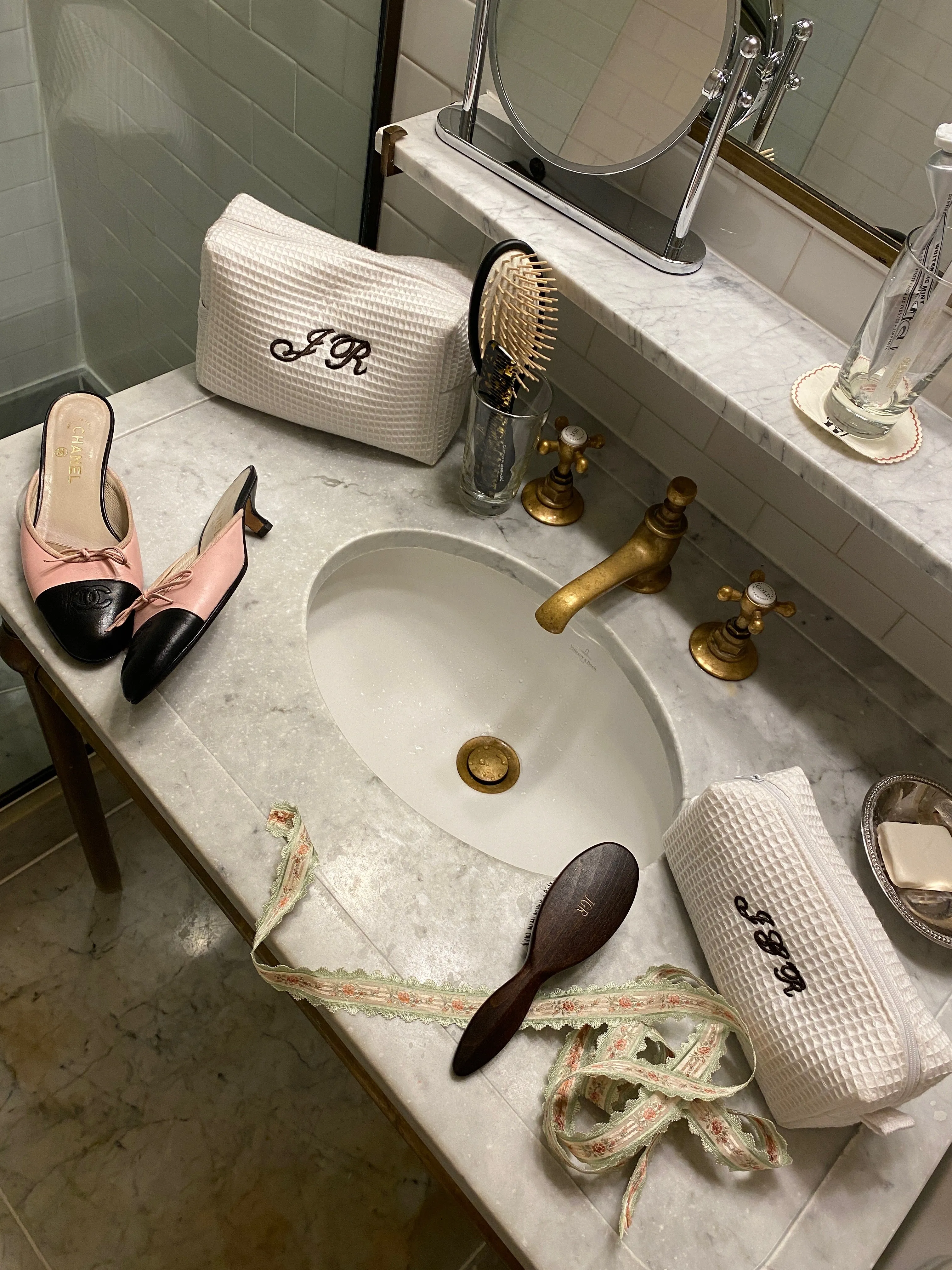 large white monogrammed makeup bag