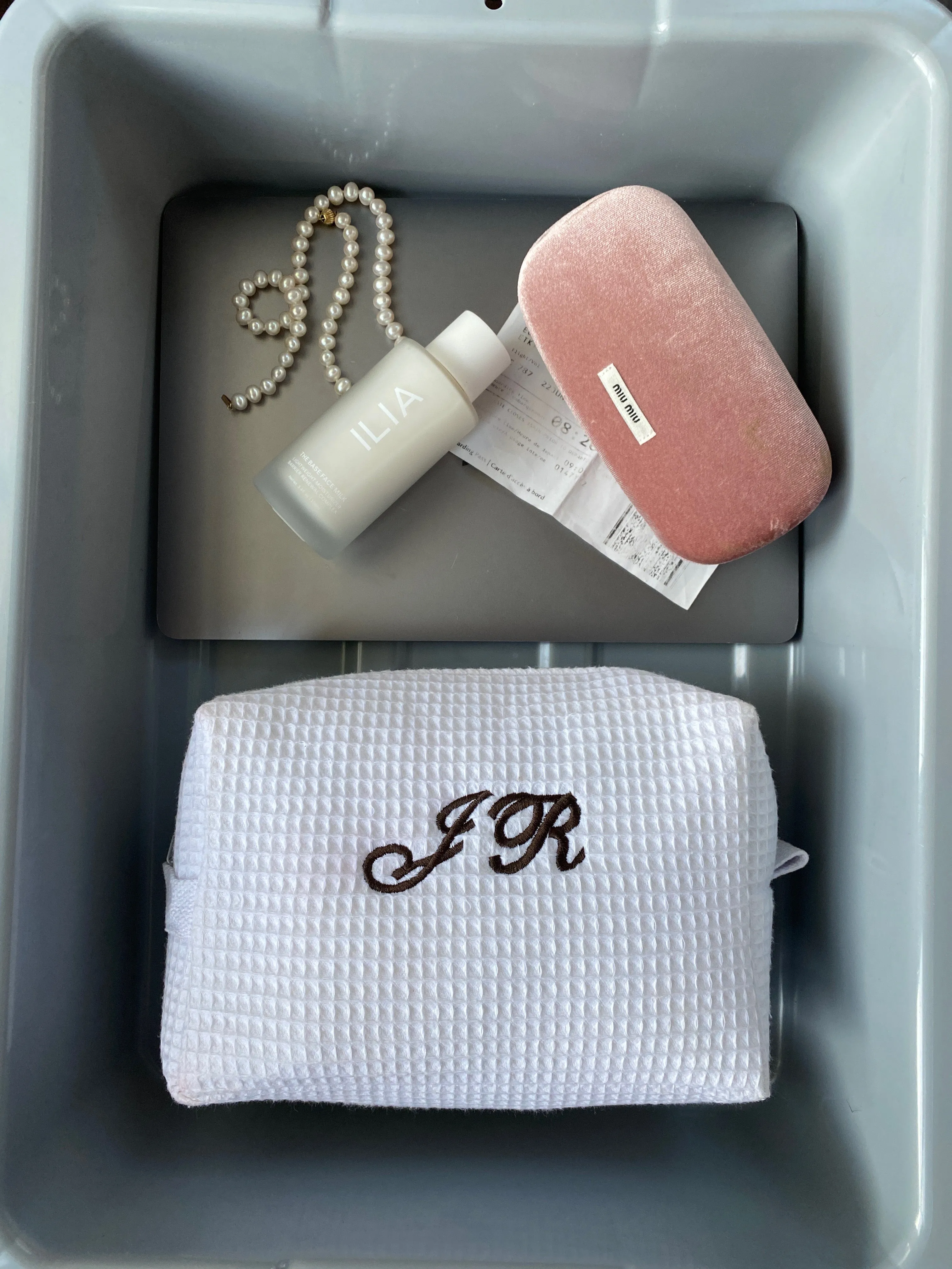 large white monogrammed makeup bag