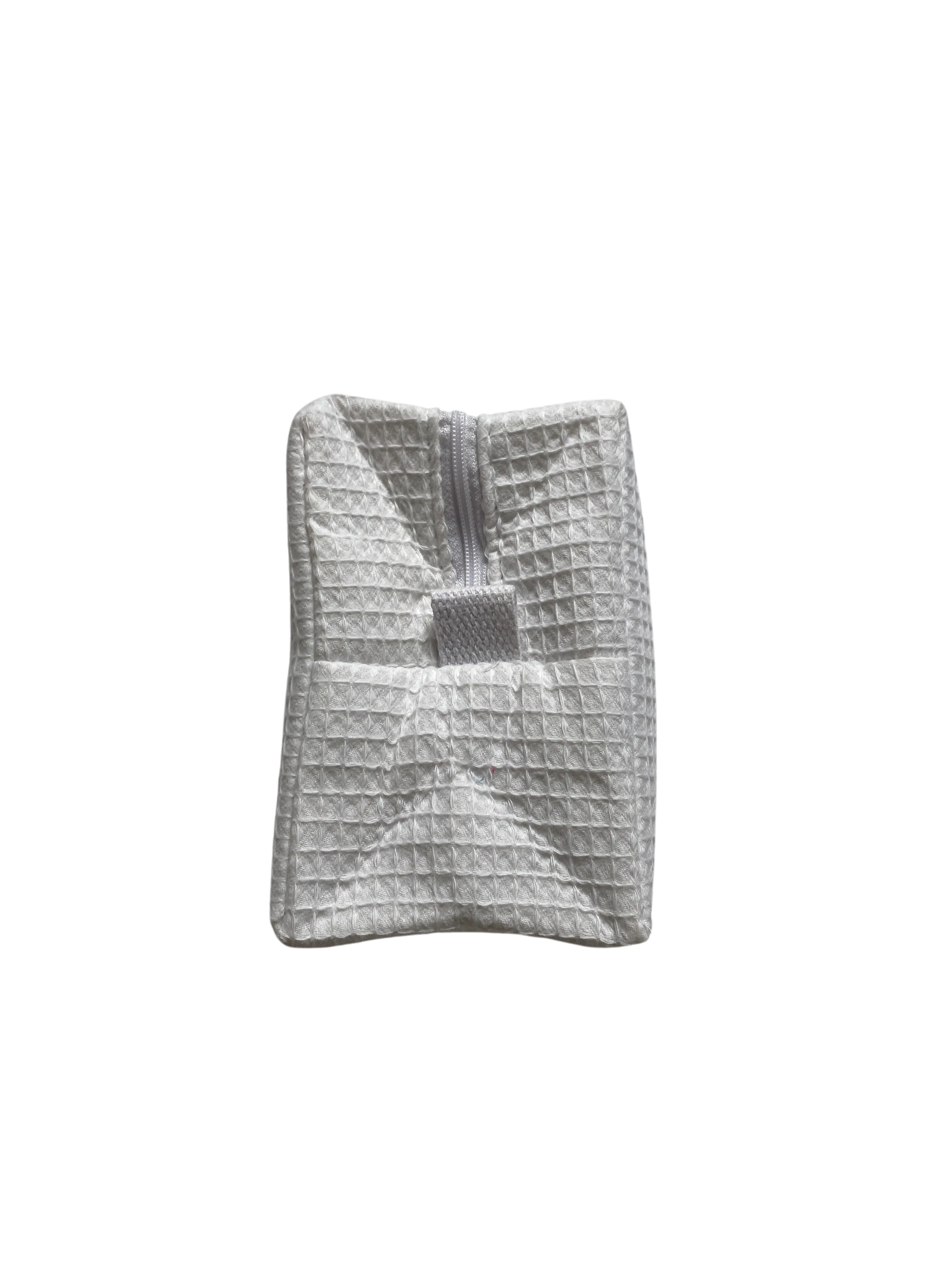 large white monogrammed makeup bag