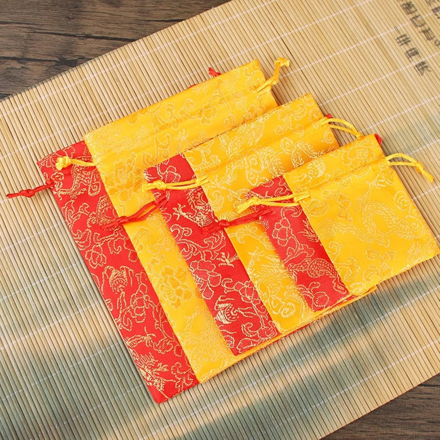 NDCNCQ 20Pcs Drawstring Gift Bags Chinese Lunar New Year Gift Bags Brocade Jewelry Pouch Bags for Jewelry Candy Good Luck Gift (Yellow,13x18cm/5.1x7.1inch)